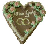 Cremtorte in Herzform mit Beschriftung Alles Gute